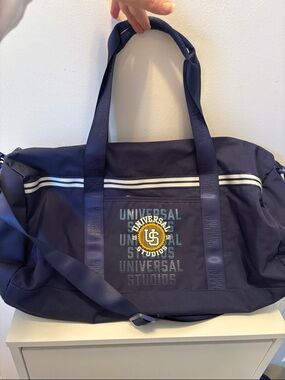 Limited 1912 Universal Studios Navy Duffel Bag with Yellow Logo Accent